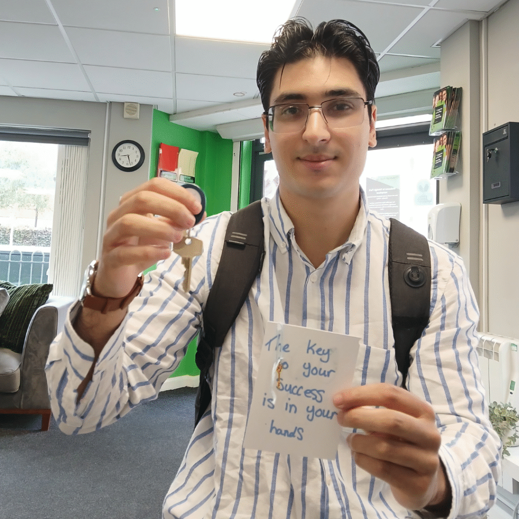 Zachary, an Acis Student, receiving his ornamental key